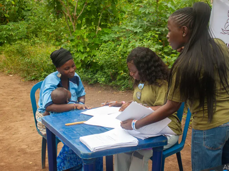 A community health-education session led by trusted local voices.