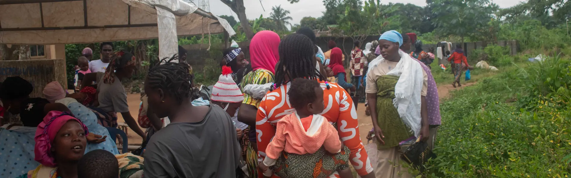Attendees gathered under a tent at the Ikogbo outreach.