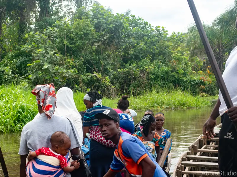 Women and an infant seated in the boat during the crossing.